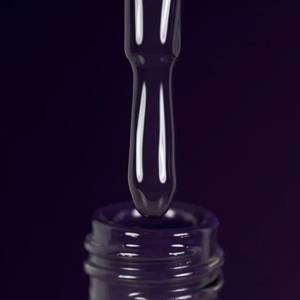DARK Gel polish - purple liquid dripping into a glass container