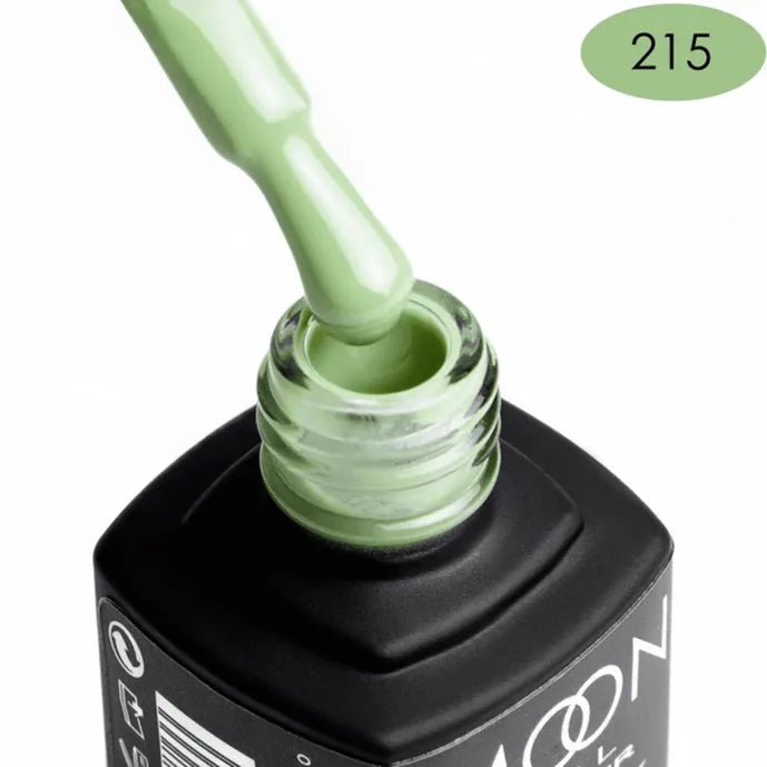 Green nail polish being applied with a brush, showing color code 215. Brand: MOON