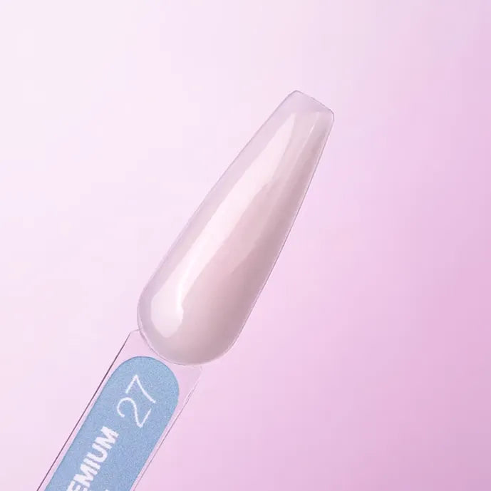 Nail tip with 'LUNA Premium 27' label on a pink background
