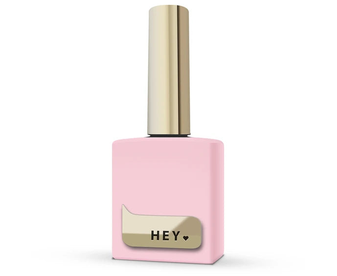 Pink nail polish bottle with gold cap and 'HEY' label on a white background