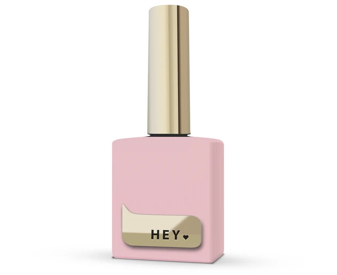 Pink nail polish bottle with gold cap and 'HEY' label on a white background