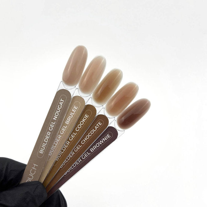 Set of TOUCH Builder Gel applicators with brown shades on a white background