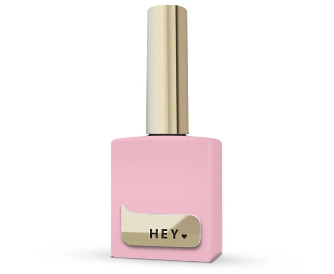 Pink nail polish bottle with gold cap and 'HEY' label on a white background