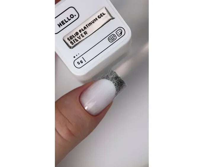 Small container labeled 'Solid Platinum Gel Silver' with a applicator on a neutral background