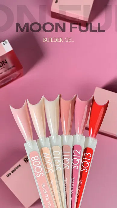 Set of nail tips with 'MOON FULL' branding on a pink background