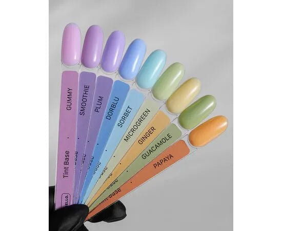 Color swatch card with pastel nail polish colors on a gray background