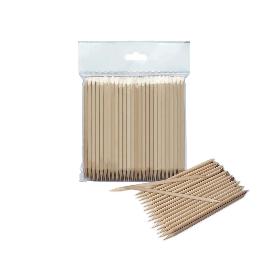Packaged wooden toothpicks with some outside the packaging on a white background