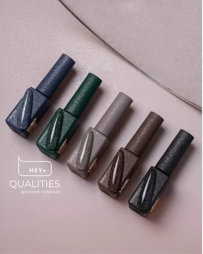 Set of six gel nail polishes in different colors on a light pink background with 'Hey Qualities' branding.