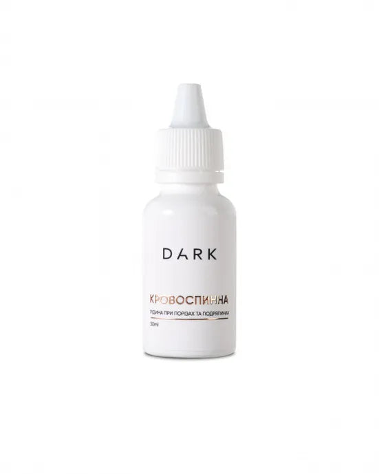 White bottle hemostatic liquid labeled 'DARK' on a white background