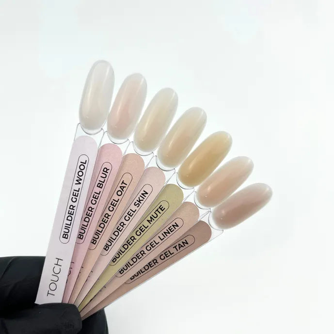 Set of TOUCH Builder Gel applicators with various colors and names on a white background